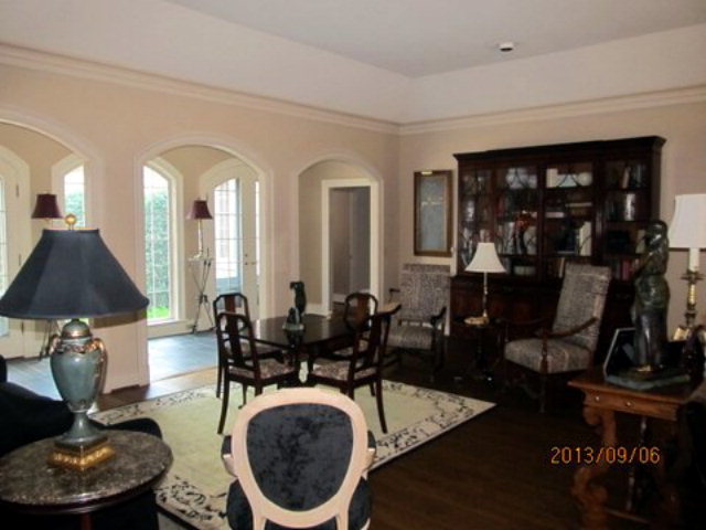 5150 Zebulon Road Macon, GA 31210 - Photo 2 of 33 a living room with furniture a lamp and rug