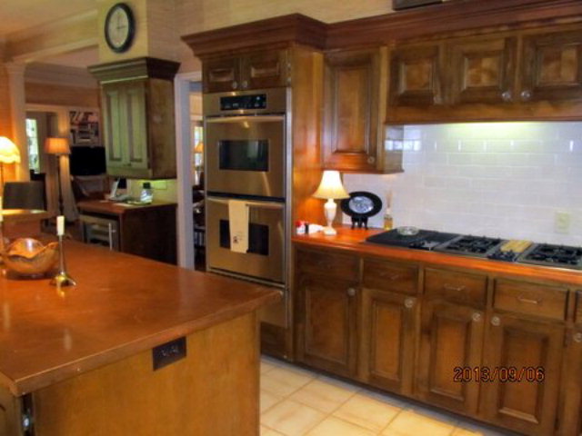 5150 Zebulon Road Macon, GA 31210 - Photo 15 of 33 a kitchen with stainless steel appliances a refrigerator and a stove top oven