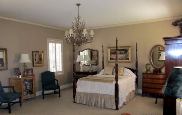 5150 Zebulon Road Macon, GA 31210 - Photo 24 of 33 a bedroom with bed and a chandelier
