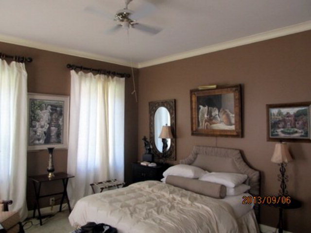 5150 Zebulon Road Macon, GA 31210 - Photo 25 of 33 a bedroom with a bed a mirror and a window