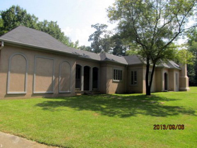 5150 Zebulon Road Macon, GA 31210 - Photo 29 of 33 a view of a sitting area in front of a house with a large tree