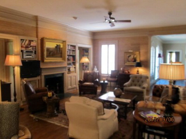 5150 Zebulon Road Macon, GA 31210 - Photo 7 of 33 a living room with furniture a fireplace and a lamp