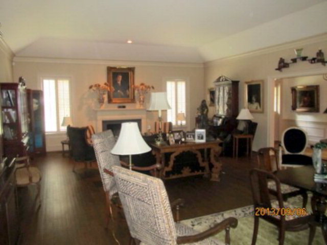 5150 Zebulon Road Macon, GA 31210 - Photo 9 of 33 a living room with fireplace furniture and a flat screen tv