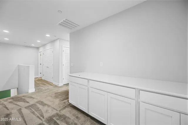 a view of a livingroom with an empty space and a window