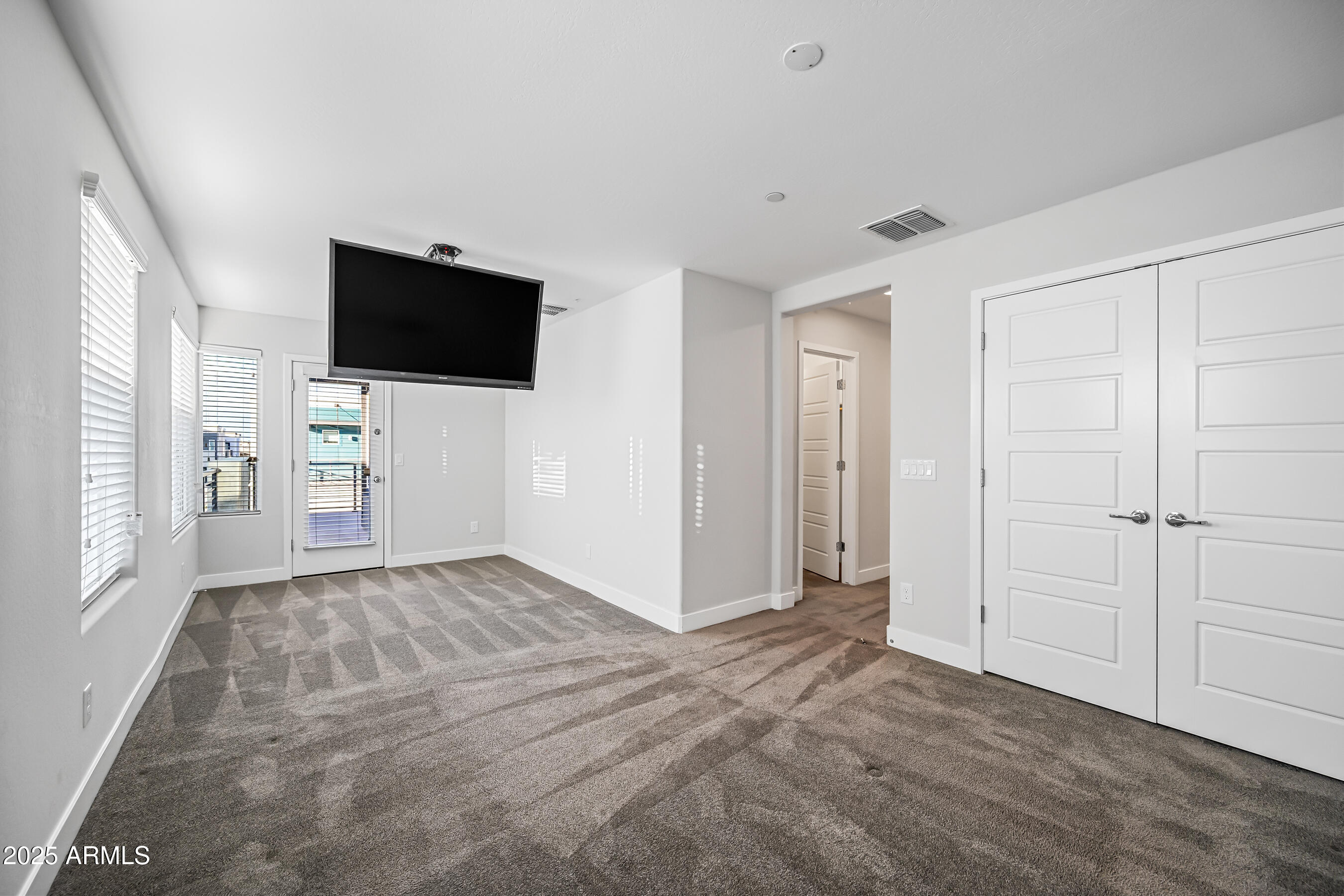 1250 Abbey Lane, Unit 289 Chandler, AZ 85226 - Photo 21 of 36 a view of a livingroom with an empty space and a window