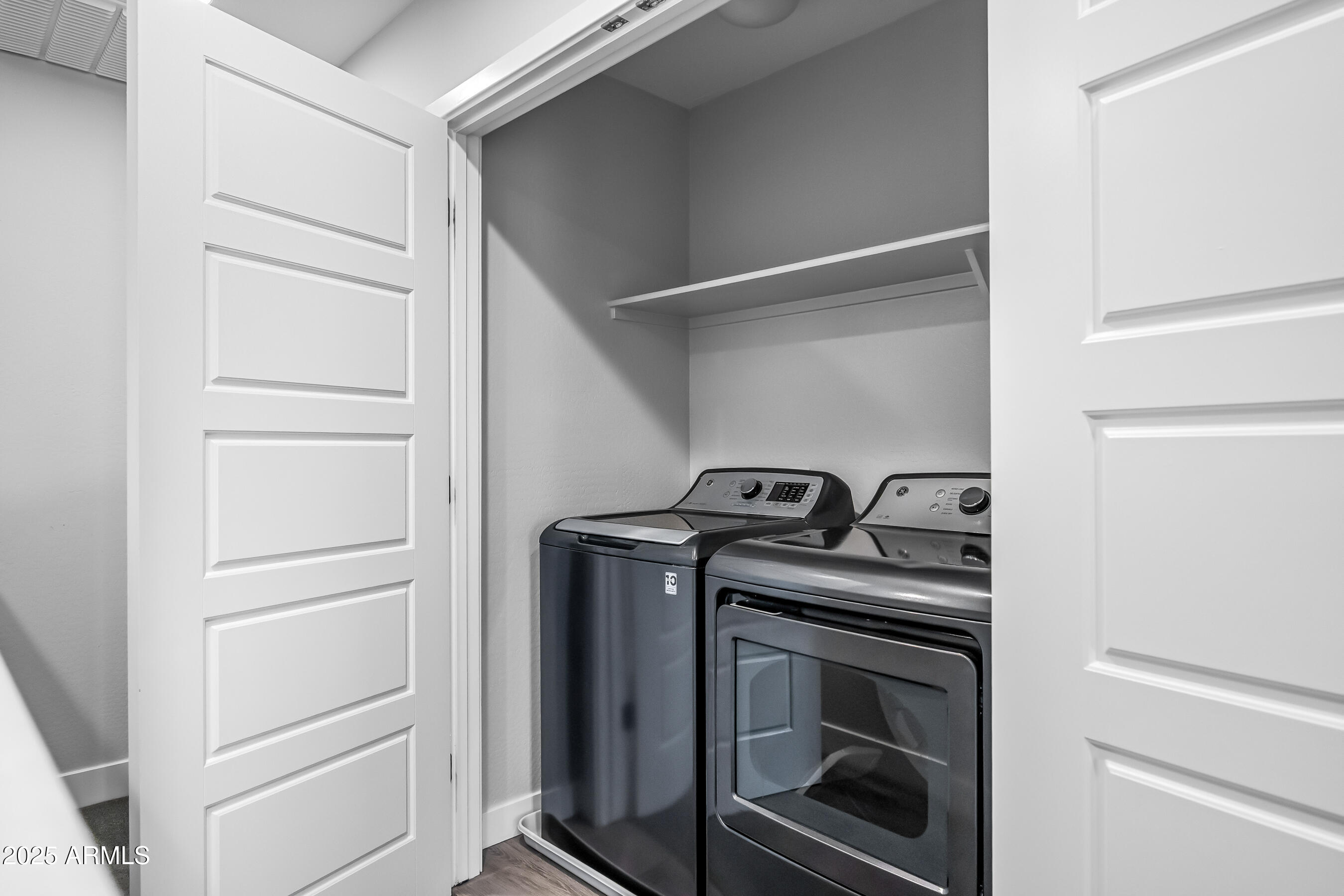 1250 Abbey Lane, Unit 289 Chandler, AZ 85226 - Photo 24 of 36 a view of a storage and utility room with washer and dryer
