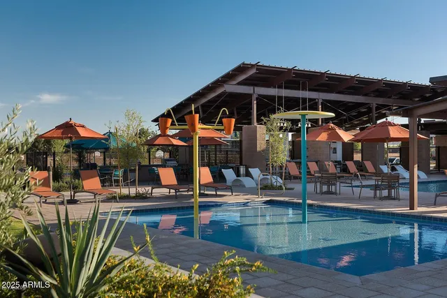 a view of a swimming pool with a patio