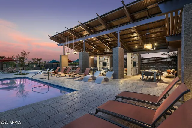 a patio with table and chairs