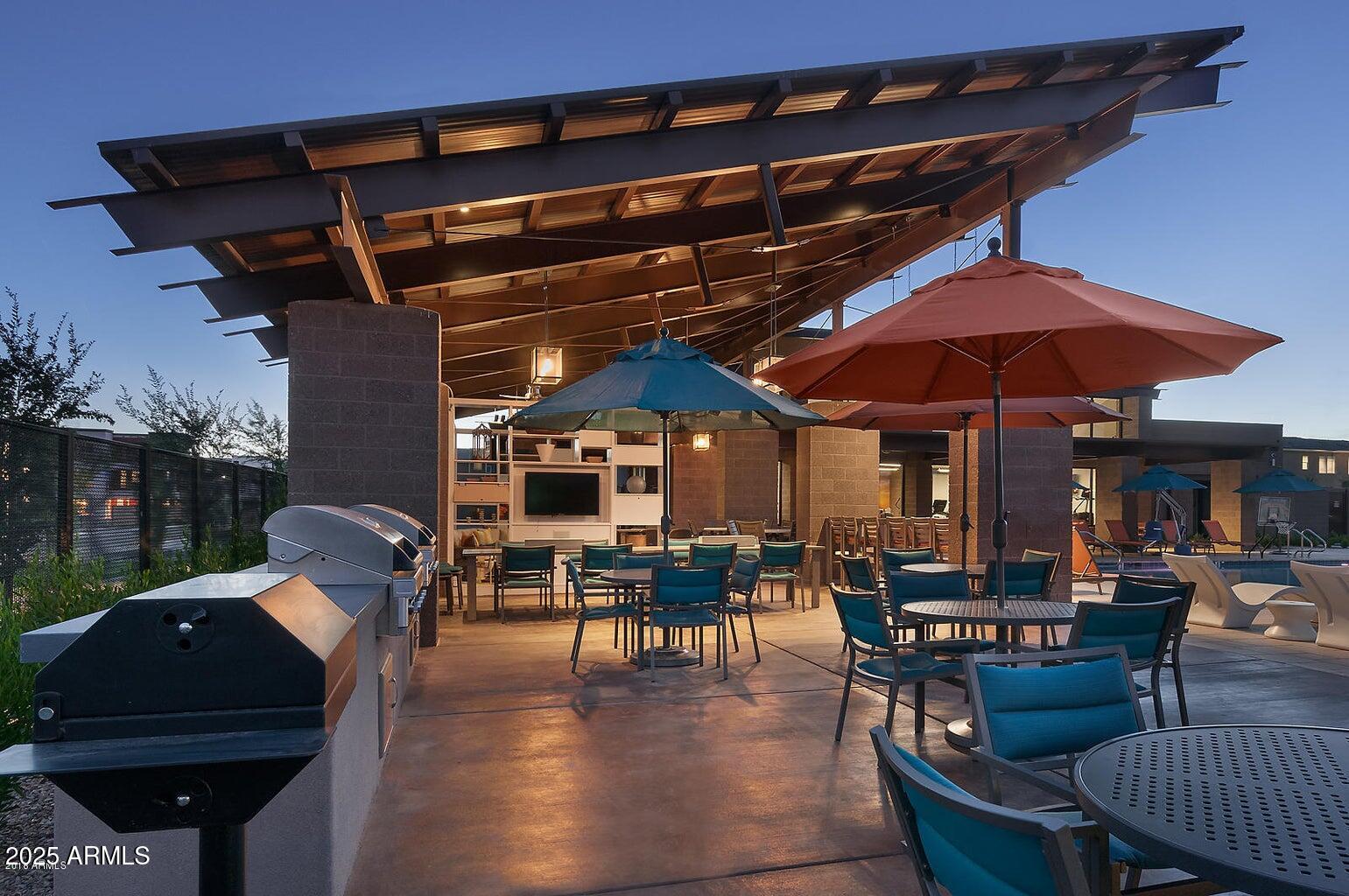 1250 Abbey Lane, Unit 289 Chandler, AZ 85226 - Photo 34 of 36 a patio with table and chairs