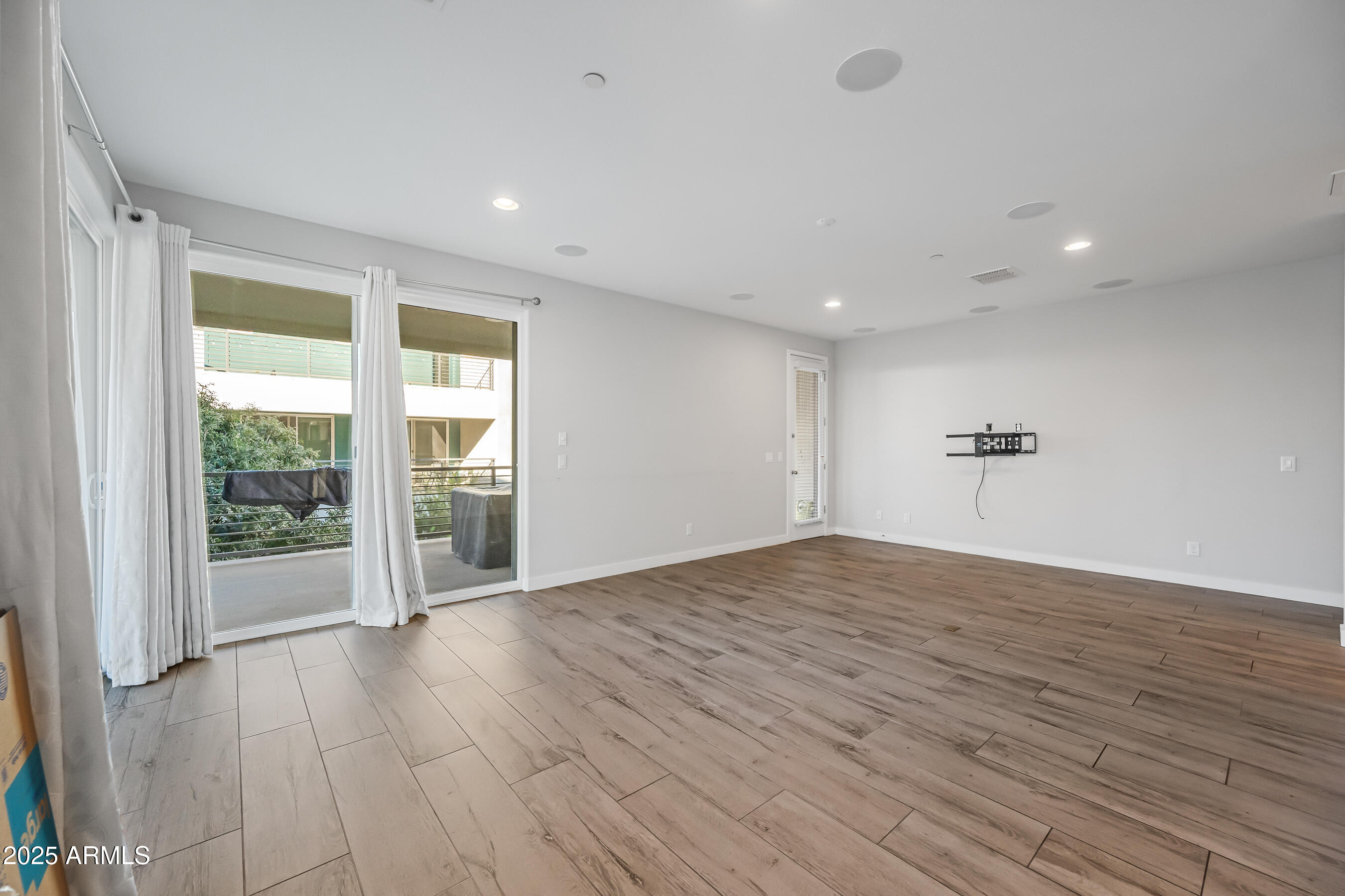 1250 Abbey Lane, Unit 289 Chandler, AZ 85226 - Photo 5 of 36 a view of empty room with wooden floor and fan