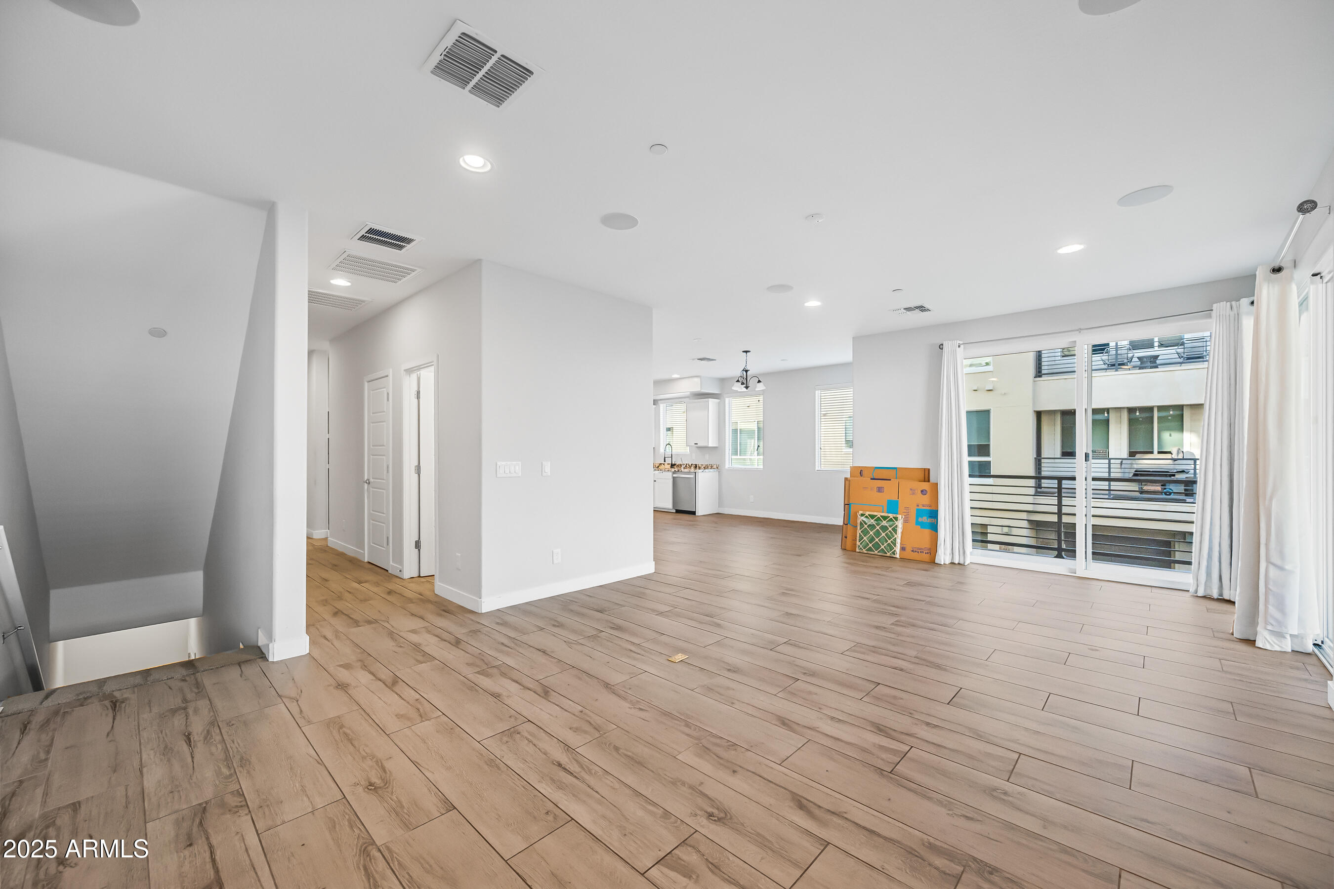 1250 Abbey Lane, Unit 289 Chandler, AZ 85226 - Photo 6 of 36 a view of an empty room with wooden floor