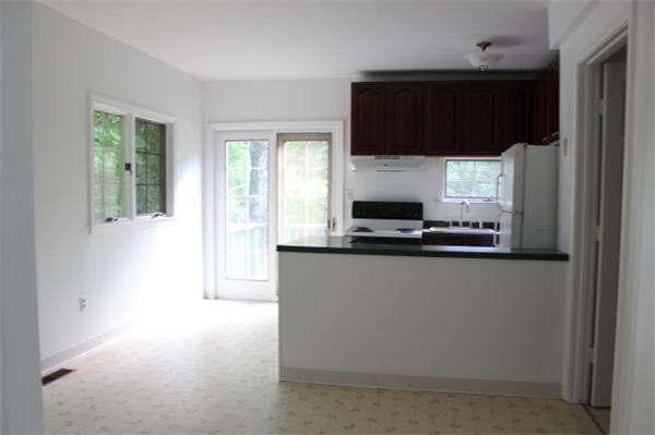 1673 Petersham Road Athol, MA 01331 - Photo 2 of 5 a kitchen with a refrigerator and a stove top oven