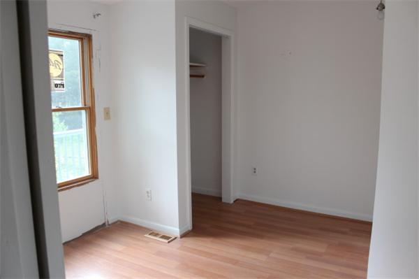 1673 Petersham Road Athol, MA 01331 - Photo 4 of 5 an empty room with wooden floor and a window