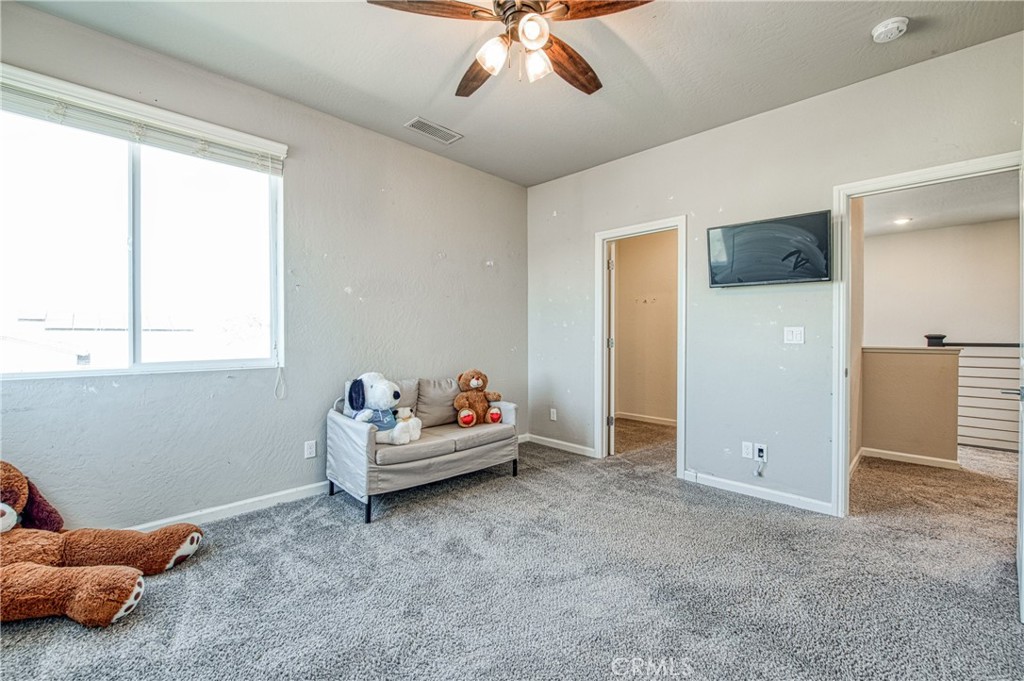 4135 Mecca Avenue Clovis, CA 93619 - Photo 22 of 32 a living room with furniture and a window