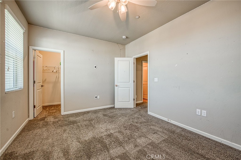 4135 Mecca Avenue Clovis, CA 93619 - Photo 28 of 32 a view of an empty room and chandelier fan