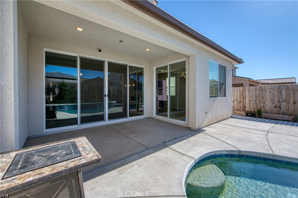 4135 Mecca Avenue Clovis, CA 93619 - Photo 31 of 32 a house view with a backyard