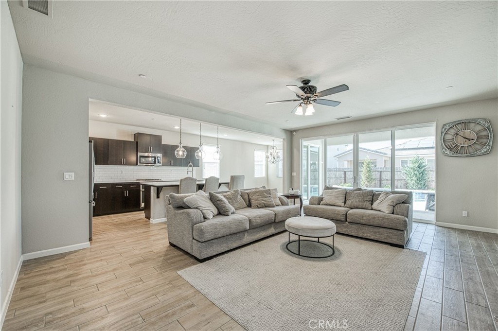 4135 Mecca Avenue Clovis, CA 93619 - Photo 7 of 32 a living room with furniture and a large window