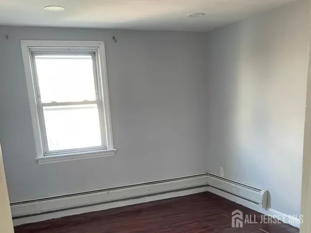a room with window and wooden floor