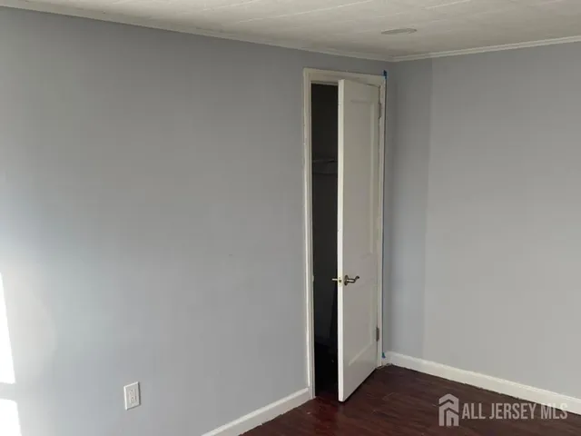 a view of front door with wooden floor