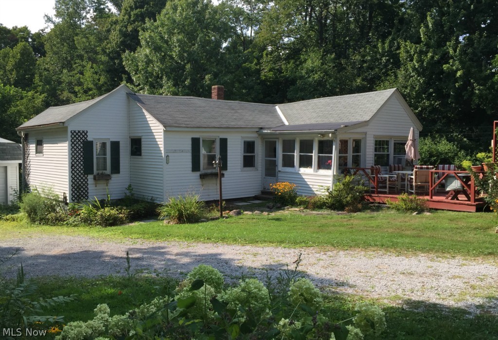 A view of the front of the home, well set back from the road.
