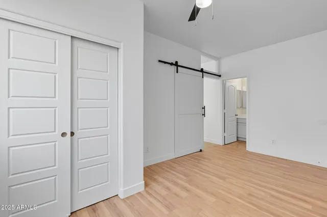 a bathroom with a sink toilet vanity and shower