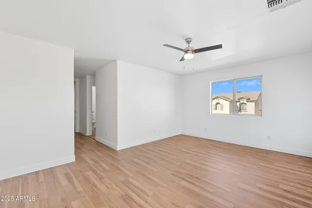 a bathroom with a double vanity sink a mirror and a bathtub