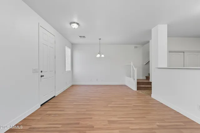 a view of a house with wooden floor and a large window