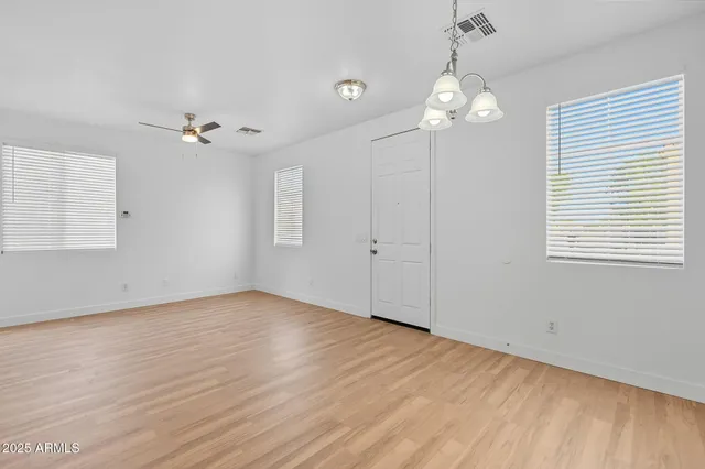 a kitchen with stainless steel appliances granite countertop a stove a sink dishwasher a refrigerator and a microwave oven