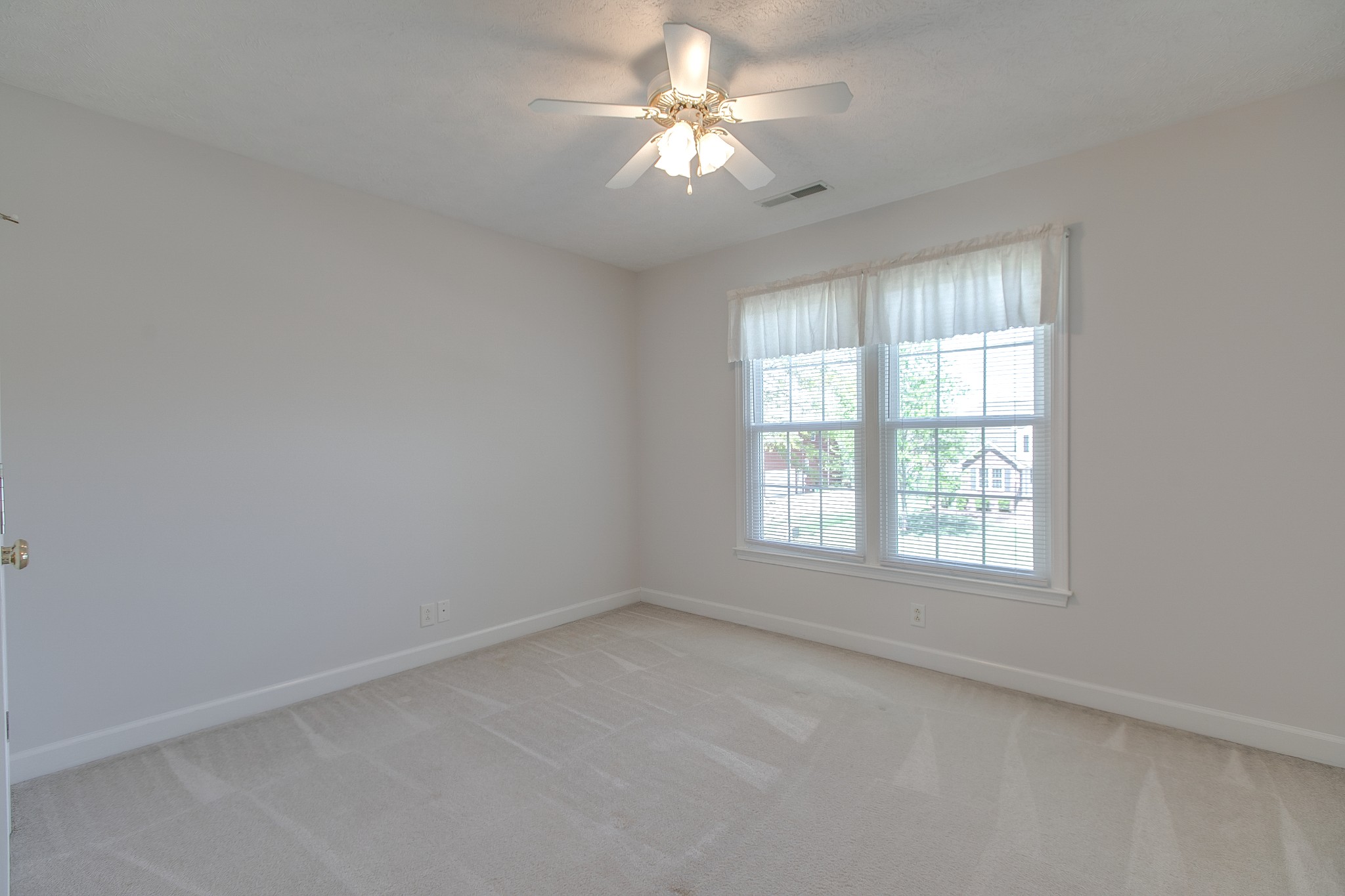 206 Sayre Lane Murfreesboro, TN 37127 - Photo 25 of 29 an empty room with a window and a fan