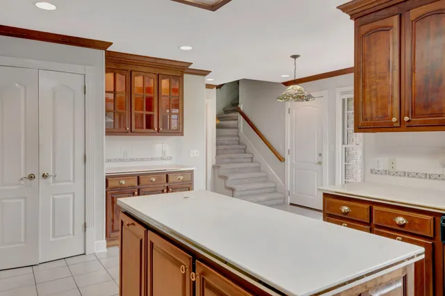 a view of a kitchen with furniture and wooden floor