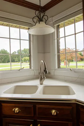 a close view of sink and a microwave