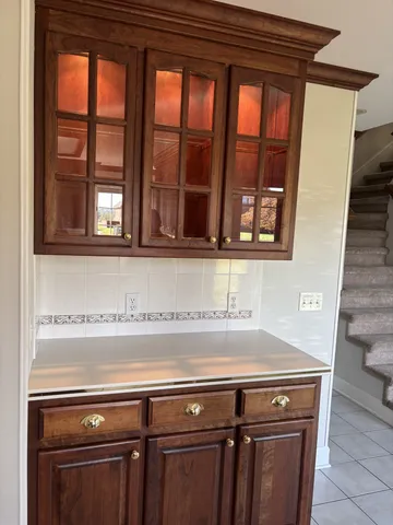 a view of washer and dryer with kitchen in the background