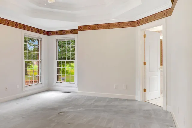 a view of empty room with floor to ceiling window