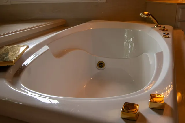 a bathroom with a double vanity sink mirror and shower