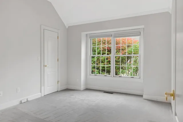 a bathroom with a toilet and a shower curtain