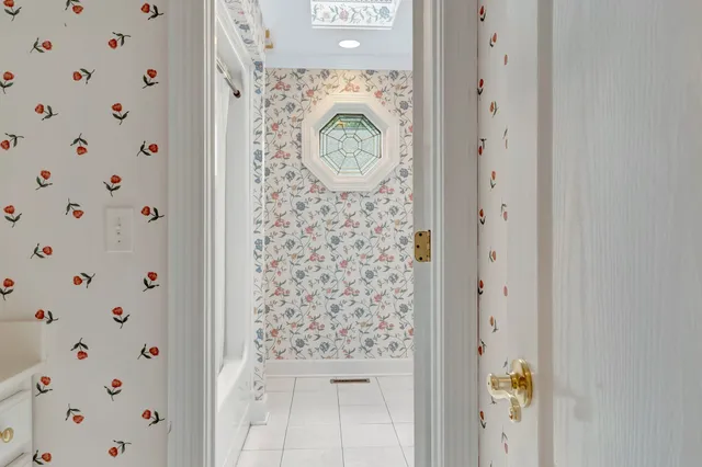 a bathroom with a sink mirror and vanity