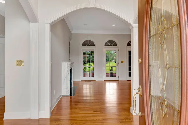 a view of an entryway with wooden floor