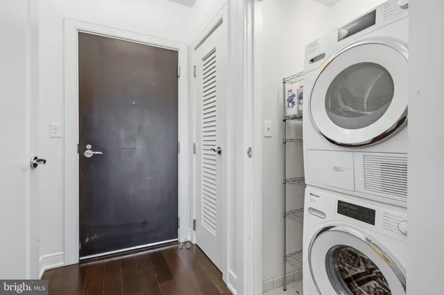 a view of bathroom with washer and dryer