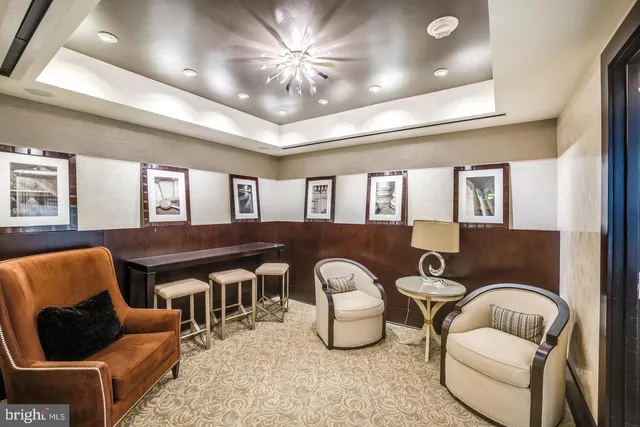 a view of a city from a dining room with furniture