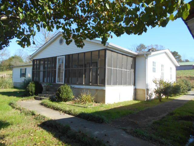 2131 Strawhill Road Southeast Cleveland, TN 37323 - Photo 1 of 20 a front view of a house with garden