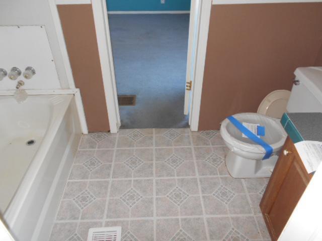 2131 Strawhill Road Southeast Cleveland, TN 37323 - Photo 14 of 20 a bathroom with a toilet and a shower