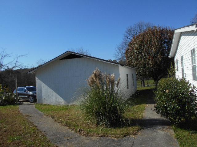 2131 Strawhill Road Southeast Cleveland, TN 37323 - Photo 7 of 20 a backyard of a house with plants and trees