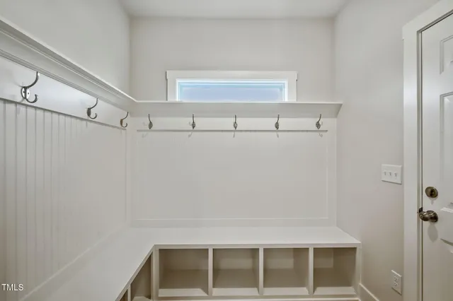 a view of storage and utility room with windows