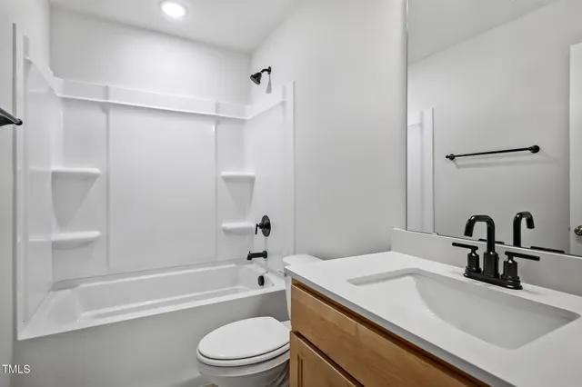 a bathroom with a sink a toilet and a bathtub