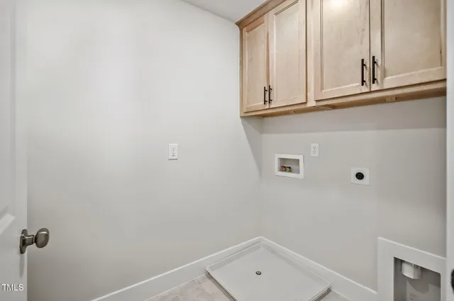 a bathroom with a sink and cabinets