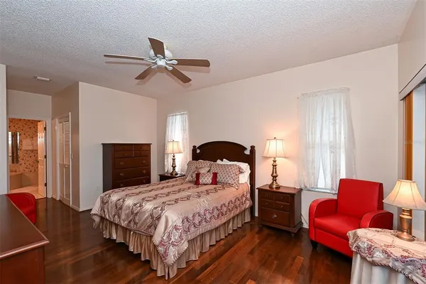 a living room with a bed furniture and a window