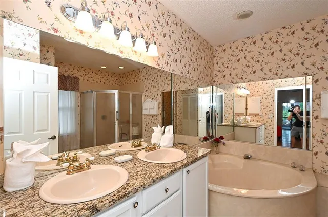 a bathroom with a shower and a sink