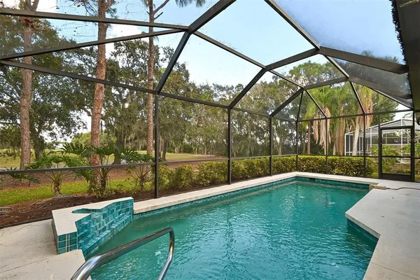 a view of a park with large trees