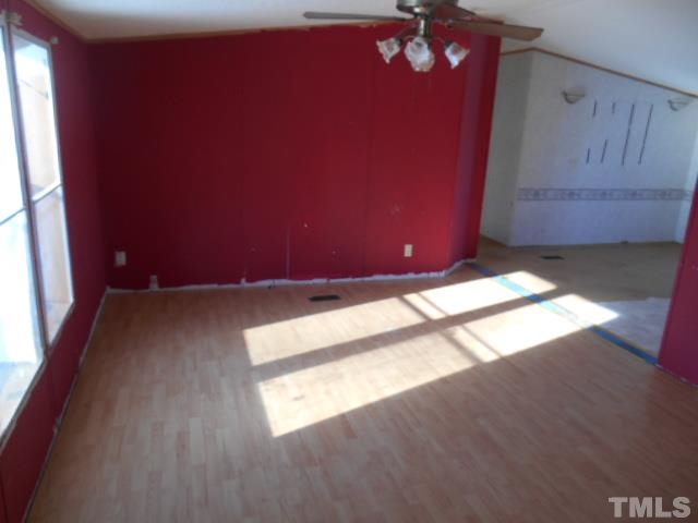 1251 Concord Ceffo Road Roxboro, NC 27574 - Photo 3 of 12 a view of an empty room and window