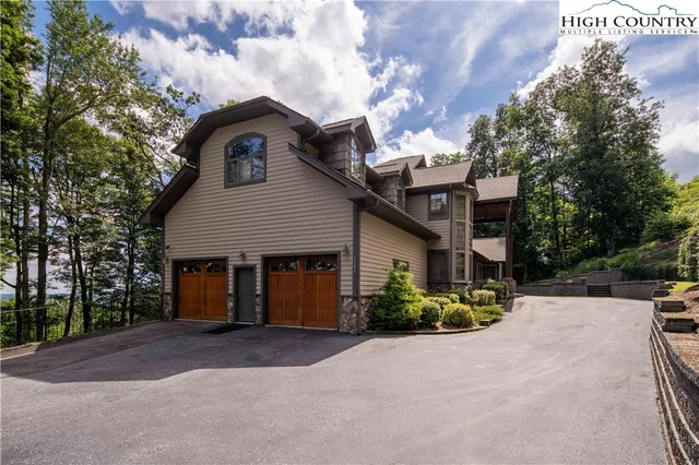 a view of a garden with mountains in the background